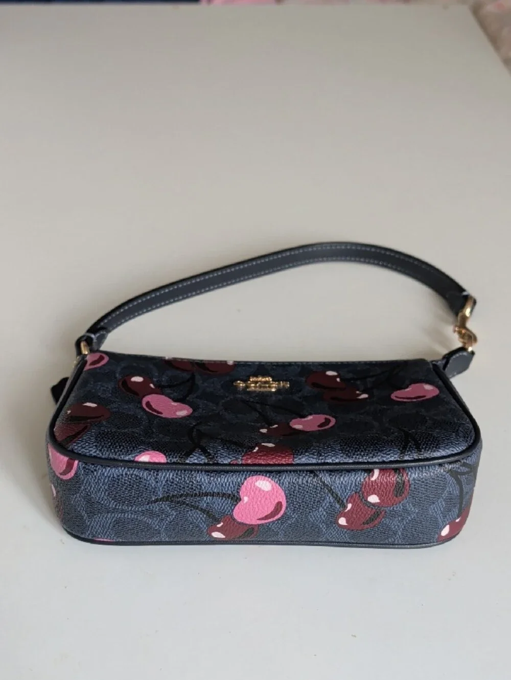 Coach Black Cherry Print Wristlet with Pink Accents
